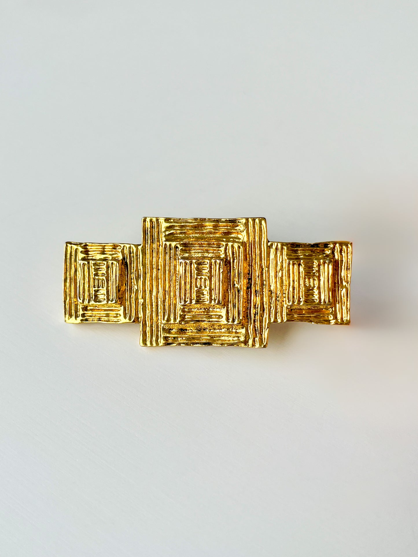 Broche dorée Ted Lapidus
