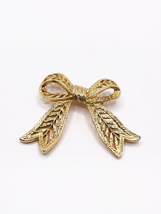 Coquette golden knot brooch