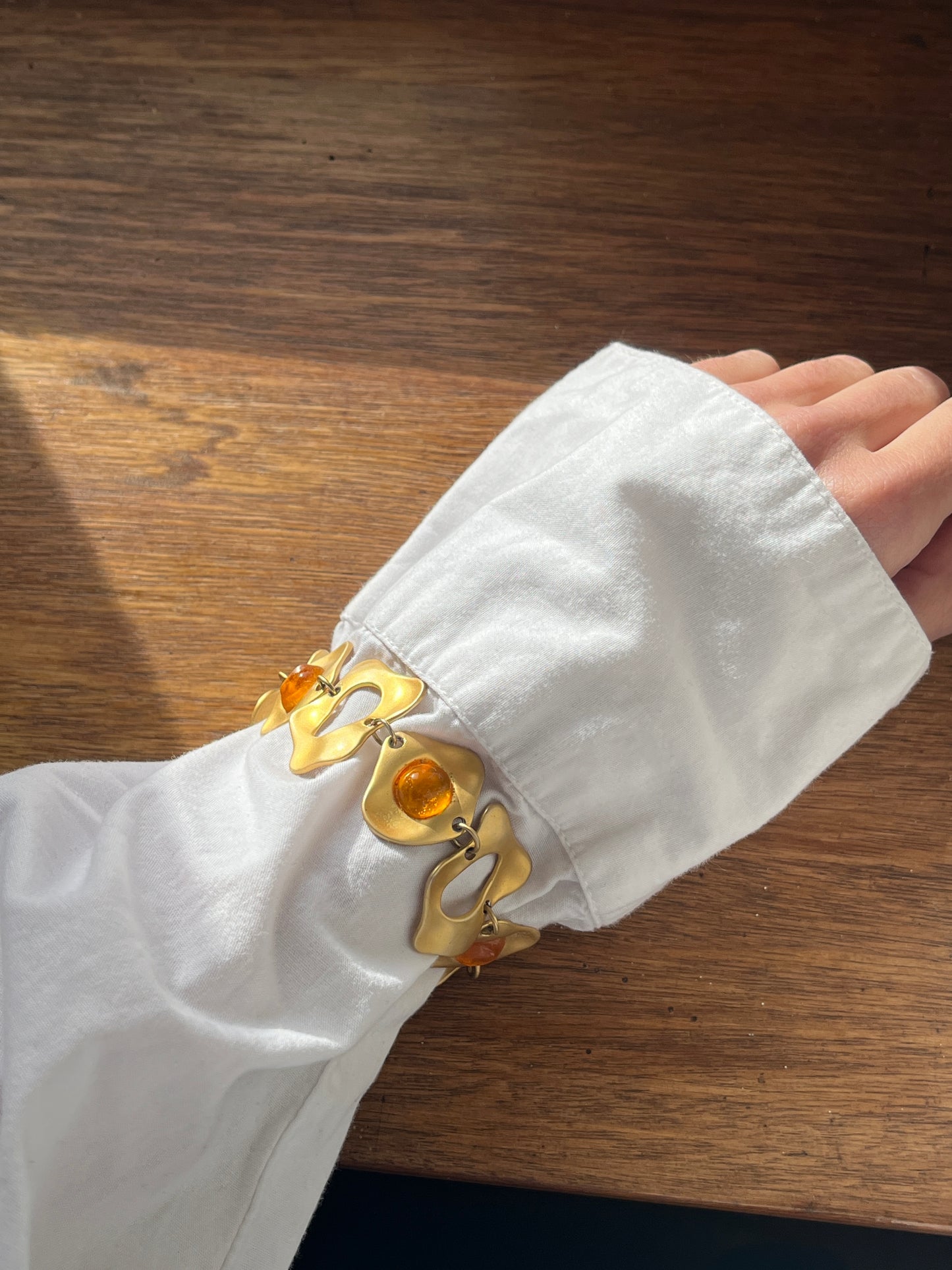 Bracelet doré cabochons orange