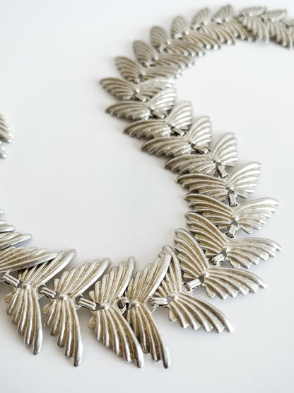 Collier papillons argenté